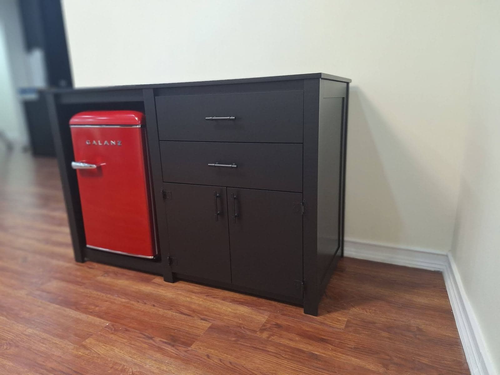 Espresso-stained beverage cabinet with drawers and a built-in bay for a red retro mini fridge